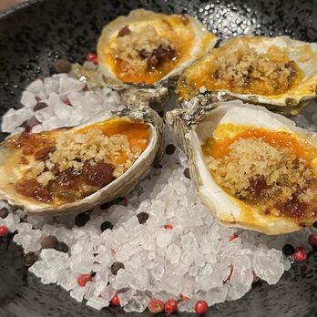 Riel - Grilled oysters with XO sauce and roasted garlic vinaigrette. Excellent. - New American Near Me - Houston, Texas Riel - Grilled oysters with XO sauce and roasted garlic vinaigrette. Excellent. - New American Near Me - Houston, Texas