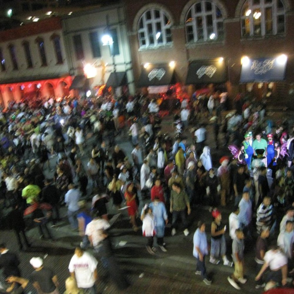 Blind Pig Pub - Rooftop Fun - Halloween - Looking down to 6th Street - Dive Bars Near Me - Austin, Texas