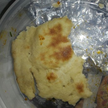 Mount Everest Restaurant - a piece of flat bread in a plastic container - Indian Near Me - Baltimore, Maryland