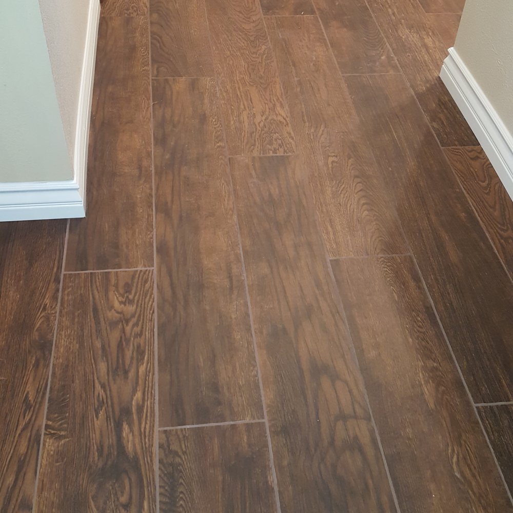 Kohler Tile & Remodel - Woodlike porcelain tiles with new baseboards. - Flooring Near Me - Anaheim, California Kohler Tile & Remodel - Woodlike porcelain tiles with new baseboards. - Flooring Near Me - Anaheim, California