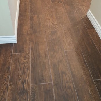 Kohler Tile & Remodel - Woodlike porcelain tiles with new baseboards. - Flooring Near Me - Anaheim, California Kohler Tile & Remodel - Woodlike porcelain tiles with new baseboards. - Flooring Near Me - Anaheim, California