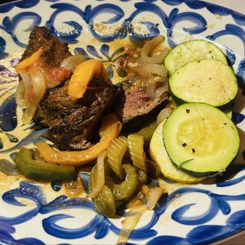West Main Kitchen - Half eaten Cajun seasoned hangar steak which was topped with mixed roasted peppers and veg. - Soup Near Me - Syracuse, Indiana