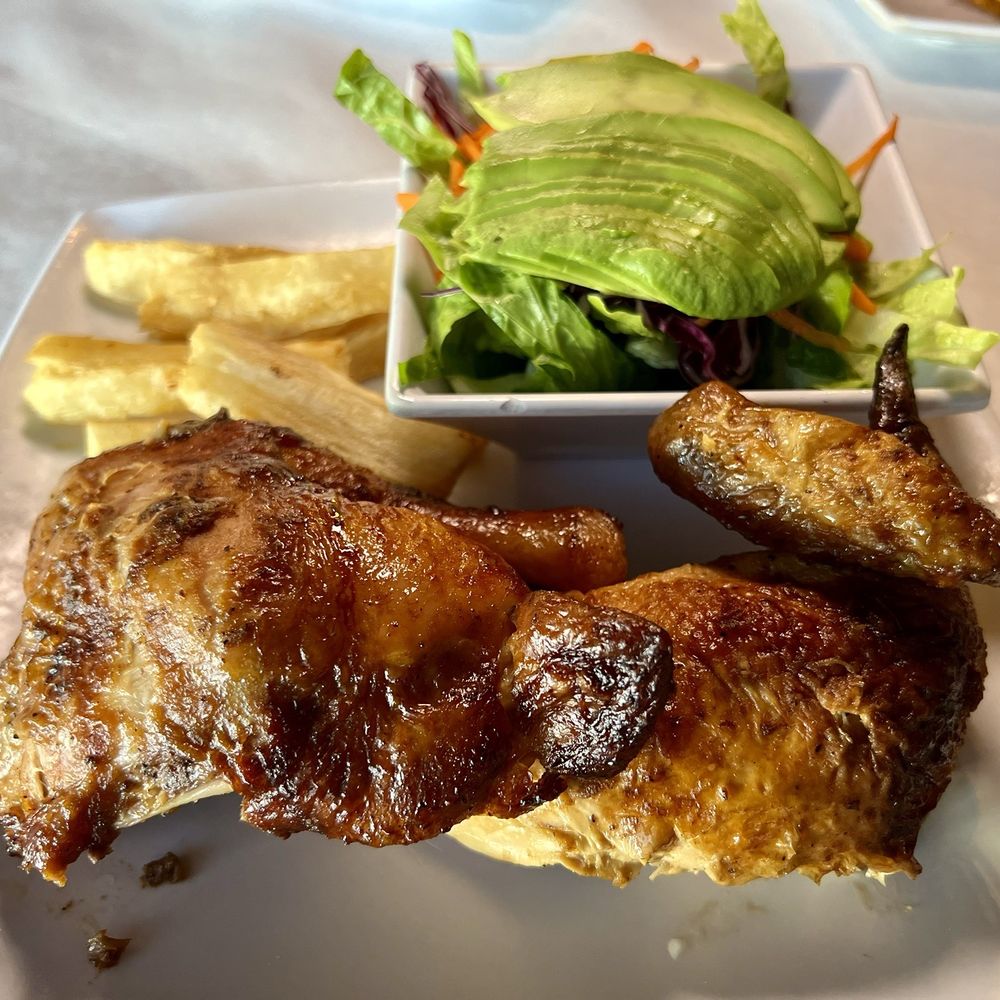 Pio Pio - 1/2 Signature chicken with fried yuca and salad - Colombian Near Me - Charlotte, North Carolina Pio Pio - 1/2 Signature chicken with fried yuca and salad - Colombian Near Me - Charlotte, North Carolina