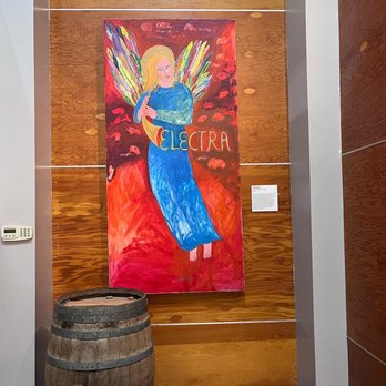 Quady Winery - a painting of an angel holding a wine barrel - Wineries Near Me - Madera, California Quady Winery - a painting of an angel holding a wine barrel - Wineries Near Me - Madera, California