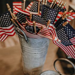 Gettysburg Flag Works - a small tin can filled to the brim with 4x6" stick flags for decorative purposes.
