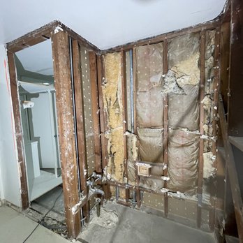 Comstruct Builders - Used to be one big closet in the guest room. Reframed to make space for laundry alcove opening to the guest bathroom (left side) - General Contractors Near Me
