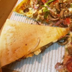 Pizza Hut - Half ass done Pizza made by the Manager Castor the snaggle tooth guy.