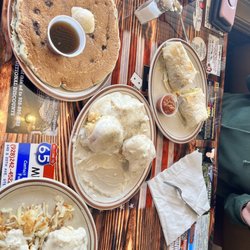 Show Low Cafe - Biscuits and gravy with hashbrowns, chorizo egg burrito and a blueberry pancake.