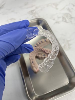 Removable Retainers & Whitening Trays - Maintain your smile with our Custom Removable Retainers. Don't allow your teeth to shift after all of that hardworking wearing aligners, braces or other Orthodontic Appliances. With our 3D Scan your trays could be ready to pick up in 1-2 days! These Trays also serve as a whitening tray if you are interested in at-home whitening solutions.