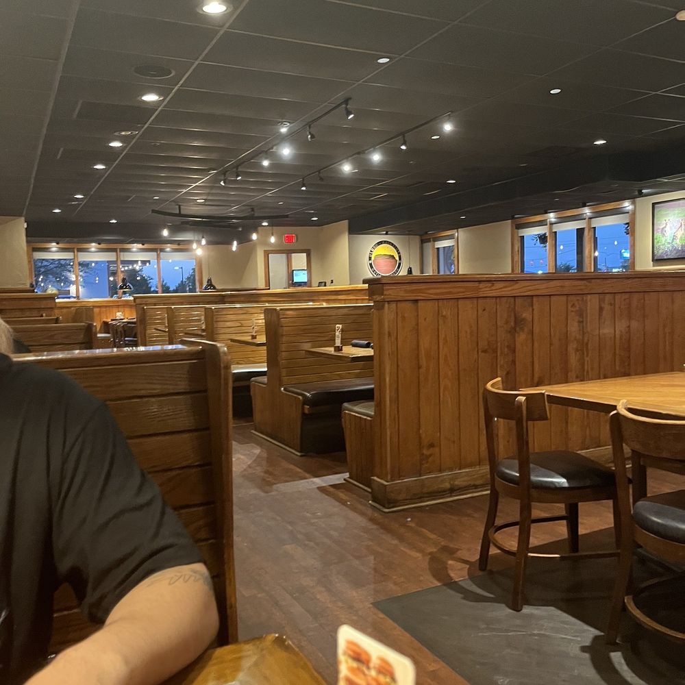 Outback Steakhouse - a man sitting at a table - Steakhouses Near Me - Jacksonville, North Carolina Outback Steakhouse - a man sitting at a table - Steakhouses Near Me - Jacksonville, North Carolina