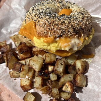 Crust Punk Baking - Your Call - Everything bagel + Vegan Cheddar + vegan sausage + vegan egg and Side Breakfast Potatoes - Bagels Near Me - Charlotte, North Carolina Crust Punk Baking - Your Call - Everything bagel + Vegan Cheddar + vegan sausage + vegan egg and Side Breakfast Potatoes - Bagels Near Me - Charlotte, North Carolina