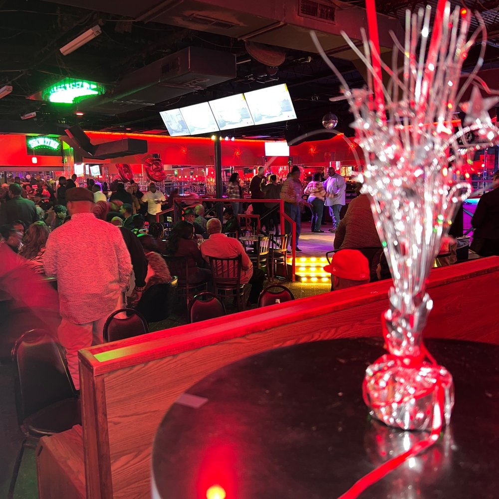 a large group of people at a bar a large group of people at a bar