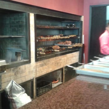 Las Tabelas - Cooking the meat - International Near Me - Oaxaca, OAX