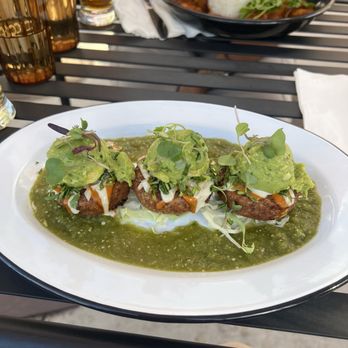 Cielo Rojo - 3 tiny sopes filled with beans with green ordinary tomatillo sauce - Mexican Near Me - Takoma Park, Maryland Cielo Rojo - 3 tiny sopes filled with beans with green ordinary tomatillo sauce - Mexican Near Me - Takoma Park, Maryland