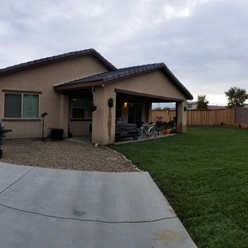 Solid Rock Landscape - Gary and his crew installed the concrete pad for our XL above ground pool. (Pic taken on panoramic mode so its stretched a bit weird.) - Landscaping Near Me