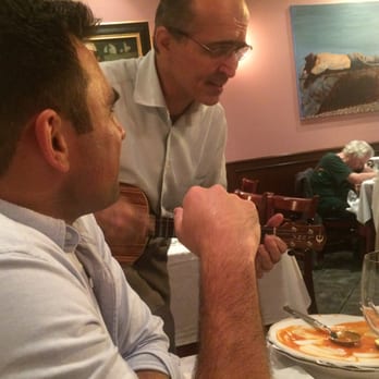Bistro 12 - Miguel (owner) playing a little yuk - Portuguese Near Me - Tarrytown, New York