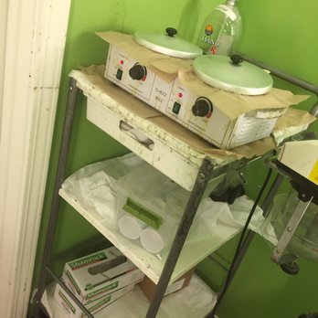 Threading Zone - Unsanitary wax machine/appliances, wall, environment. (back room) - Threading Services Near Me - Torrance, California Threading Zone - Unsanitary wax machine/appliances, wall, environment. (back room) - Threading Services Near Me - Torrance, California