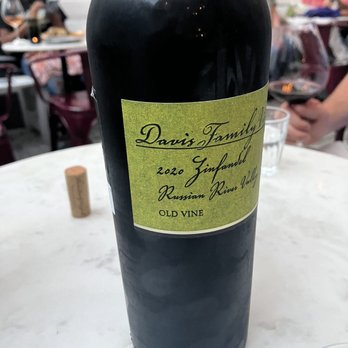 Killer Queen - a bottle of wine on a table - Wine Bars Near Me - Durham, North Carolina