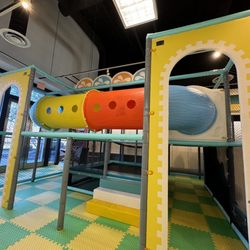 Sunshine Play - Play ground area above a trampoline.