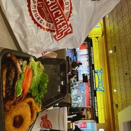Tex Mex Burger 1/2 lb with halfies onion rings and fries asked for chili but on the side -