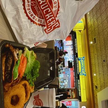 Fuddruckers - Tex Mex Burger 1/2 lb with halfies onion rings and fries asked for chili but on the side - - Burgers Near Me - Las Vegas, Nevada