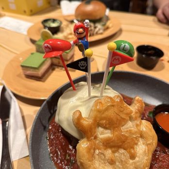 Toadstool Cafe - we took all the different themed picks we got from menu items and stuck them on my bowser's fireball challenge! - Cafes Near Me - Universal City, California Toadstool Cafe - we took all the different themed picks we got from menu items and stuck them on my bowser's fireball challenge! - Cafes Near Me - Universal City, California