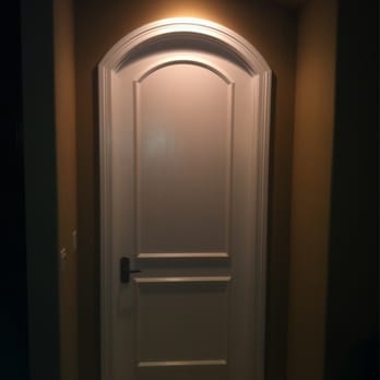 C C Construction - a white door in a dark room - General Contractors Near Me C C Construction - a white door in a dark room - General Contractors Near Me