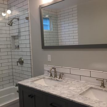 Kairos Builders - a bathroom with two sinks and a shower - General Contractors Near Me - Los Angeles, California Kairos Builders - a bathroom with two sinks and a shower - General Contractors Near Me - Los Angeles, California