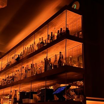 Bar Goto - shelves filled with liquor bottles - Cocktail Bars Near Me - New York, New York Bar Goto - shelves filled with liquor bottles - Cocktail Bars Near Me - New York, New York