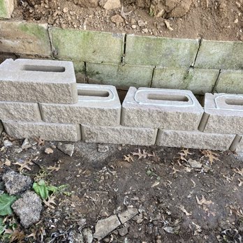 Unbreakable Roofing & Construction - a pile of cinder blocks - Roofing Near Me