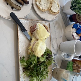 First Watch - Classic Eggs Benedict w/ lemon greens. Iced coffee, Turkey sausage and English muffin. - Breakfast & Brunch Near Me - Charlotte, North Carolina First Watch - Classic Eggs Benedict w/ lemon greens. Iced coffee, Turkey sausage and English muffin. - Breakfast & Brunch Near Me - Charlotte, North Carolina