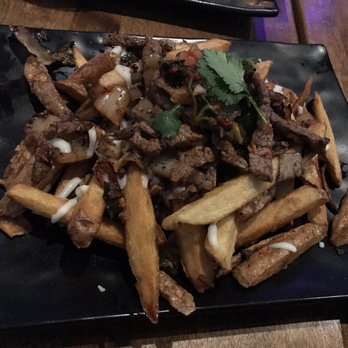 Nola Bar & Kitchen - Steak bulgogi kimchi fries - Cocktail Bars Near Me - Chicago, Illinois Nola Bar & Kitchen - Steak bulgogi kimchi fries - Cocktail Bars Near Me - Chicago, Illinois
