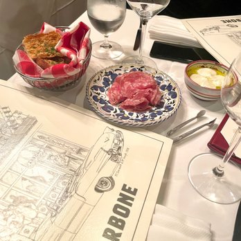 Carbone - Bread, Salami and mozzarella in oil to start - Italian Near Me - New York, New York Carbone - Bread, Salami and mozzarella in oil to start - Italian Near Me - New York, New York