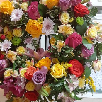 Joy Garden Flowers - Large sympathy wreath with lots of roses. - Floral Designers Near Me