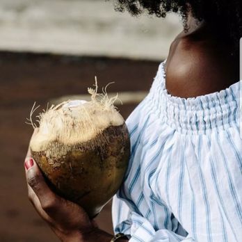 Cane & Coconut - a woman holding a coconut - Health Markets Near Me - Washington, DC, District of Columbia Cane & Coconut - a woman holding a coconut - Health Markets Near Me - Washington, DC, District of Columbia