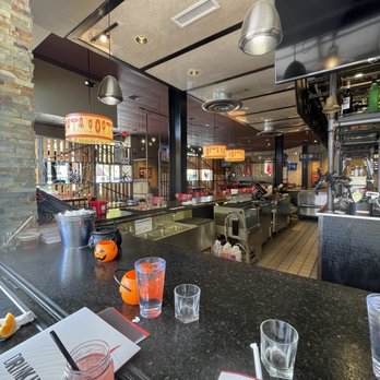 Smokey Bones  -  bar with a long counter - Barbeque Near Me - Buford, Georgia
