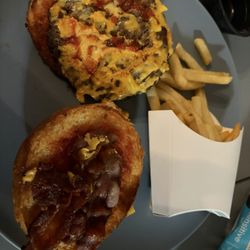 Joe Daddy's Burgers and More - Here is the bacon burger. You can see the cheese on it that I asked not to have. There's also some bacon and some ketchup that's it.