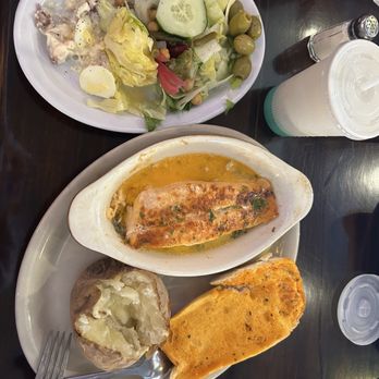 American Steakhouse - Salmon 8oz Baked in a White Wine Butter Sauce with baked potato and salad bar - American Near Me - Bridgeport, Connecticut American Steakhouse - Salmon 8oz Baked in a White Wine Butter Sauce with baked potato and salad bar - American Near Me - Bridgeport, Connecticut