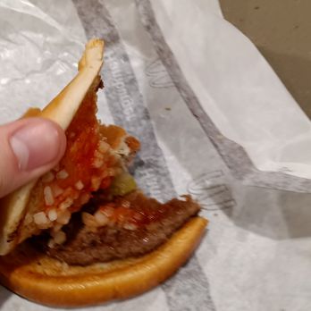 McDonald's - a hand holding a half eaten sandwich - Fast Food Near Me - Inver Grove Heights, Minnesota McDonald's - a hand holding a half eaten sandwich - Fast Food Near Me - Inver Grove Heights, Minnesota