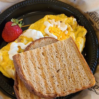 Kneaders Bakery & Cafe - Mexican Omelet - 3 ounce scrambled omelet with Pico De Gallo, cheddar cheese and crema. Served with toast and a fresh strawberry. - Cafes Near Me - Saratoga Springs, Utah