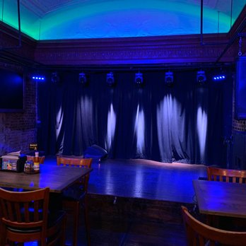 Chicho's Backstage - a stage with blue lighting - Pizza Near Me - Norfolk, Virginia