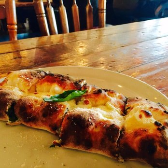 Porta - The Porta Porta is folded into a Calzone. The ricotta is whipped perfectly with cooked spinach with fresh garlic and truffle oil. - Pizza Near Me - Asbury Park, New Jersey Porta - The Porta Porta is folded into a Calzone. The ricotta is whipped perfectly with cooked spinach with fresh garlic and truffle oil. - Pizza Near Me - Asbury Park, New Jersey