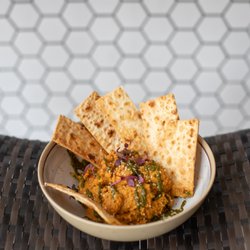 Faire Market & Cafe - Carrot Hummus, drizzled with house chermoula and served with crispy lavash