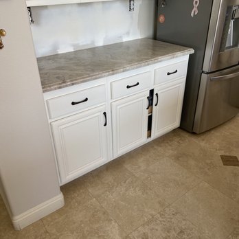 Marcor Finish Carpentry - a kitchen with white cabinets - General Contractors Near Me