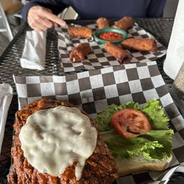 An enormous Buffalo Chicken sandwich and the best and biggest mozzarella sticks I've ever eaten ! An enormous Buffalo Chicken sandwich and the best and biggest mozzarella sticks I've ever eaten !