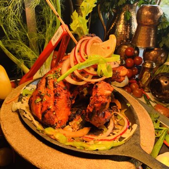 Indian Accent - a plate of food on a table - Indian Near Me - Calgary, Alberta Indian Accent - a plate of food on a table - Indian Near Me - Calgary, Alberta