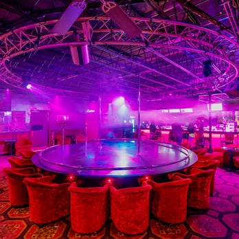 Mynx Cabaret - a circular dance floor with red and purple lighting - Adult Entertainment Near Me - Hartford, Connecticut