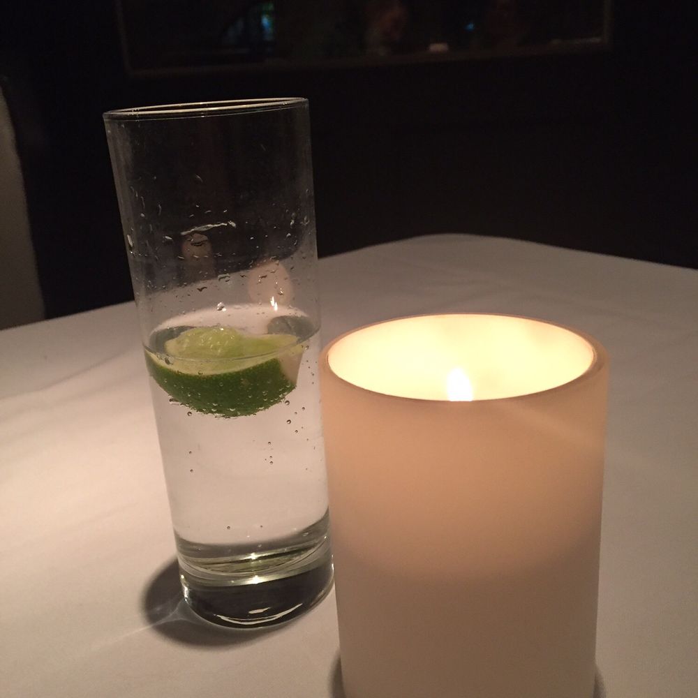St John's Restaurant - Perrier with lime and lemon with beautiful candles lighting every white clothed table. - New American Near Me - Chattanooga, Tennessee St John's Restaurant - Perrier with lime and lemon with beautiful candles lighting every white clothed table. - New American Near Me - Chattanooga, Tennessee