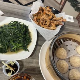 Salt and pepper squid, spinach, soup dumplings.
