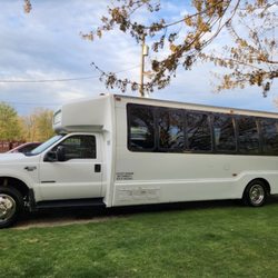 Titan Limousine - White Limo Party Bus - Up to 21 passengers with custom LED lighting in a variety of color choices, advanced sound system & more!